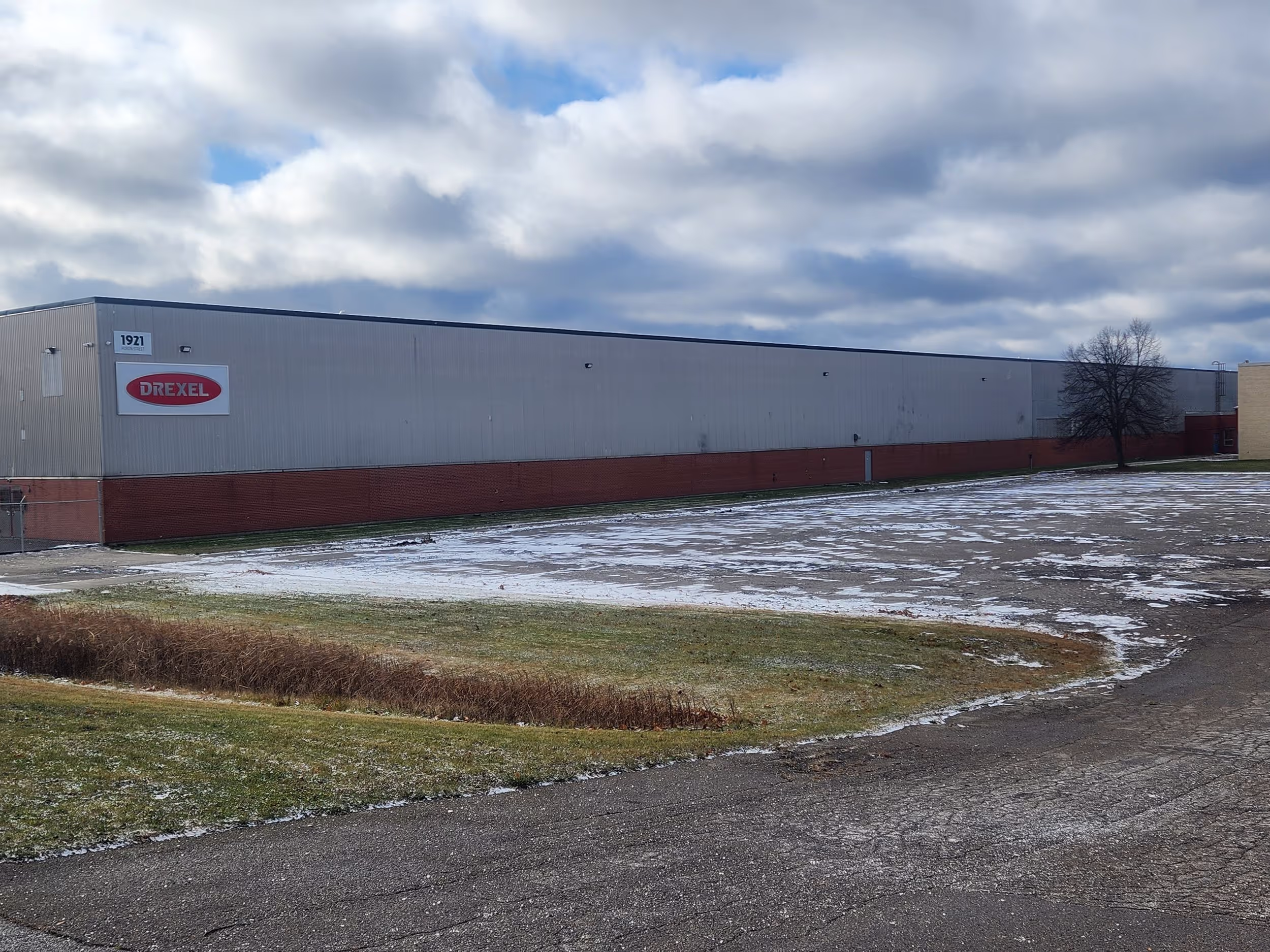 Exterior of the Drexel Industries warehouse and headquarters in London, Ontario, a long low building with the company sign.