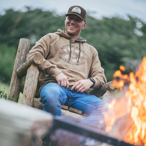 Catchin' Deers presents a rustic, outdoor-focused brand identity that appeals to hunting and outdoor enthusiasts. The website features a clean, e-commerce layout with a mobile-responsive design. The brand's visual aesthetic centers around hunting culture with product names like 'Wallhanger,' 'Hunt Camp,' 'Honey Hole,' and 'Fly Over' that resonate with the hunting community. The homepage showcases their mesh back trucker hat collection prominently, with products consistently priced at $17.49. The design emphasizes accessibility and ease of shopping with clear navigation between hats and accessories categories. The brand maintains an active social media presence on Facebook and Instagram, suggesting a community-focused approach. The overall visual presentation is straightforward and functional, prioritizing product visibility and customer reviews to build trust, with many items showing hundreds of positive reviews.