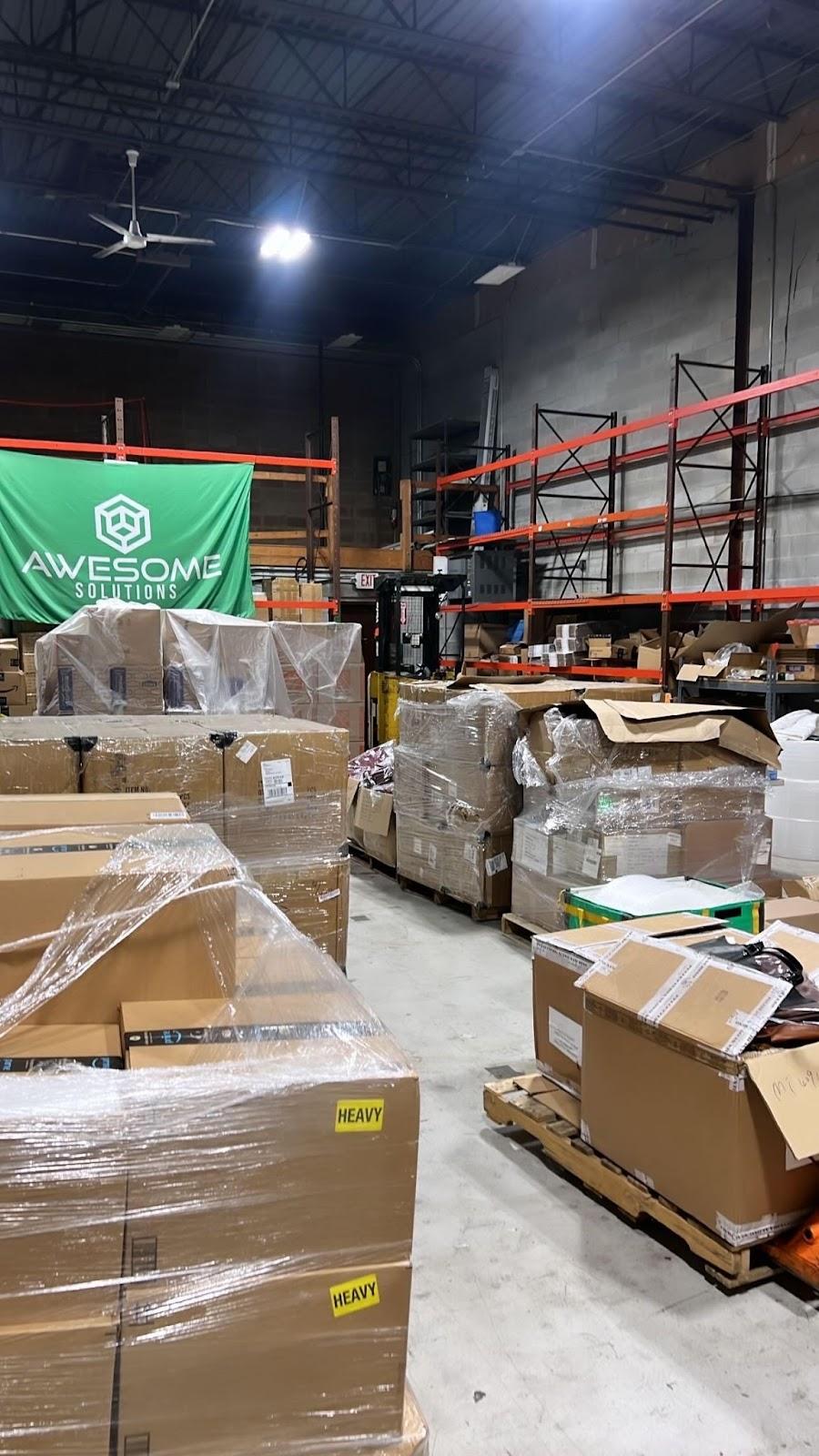Shrink-wrapped pallets inside the Awesome Solutions warehouse