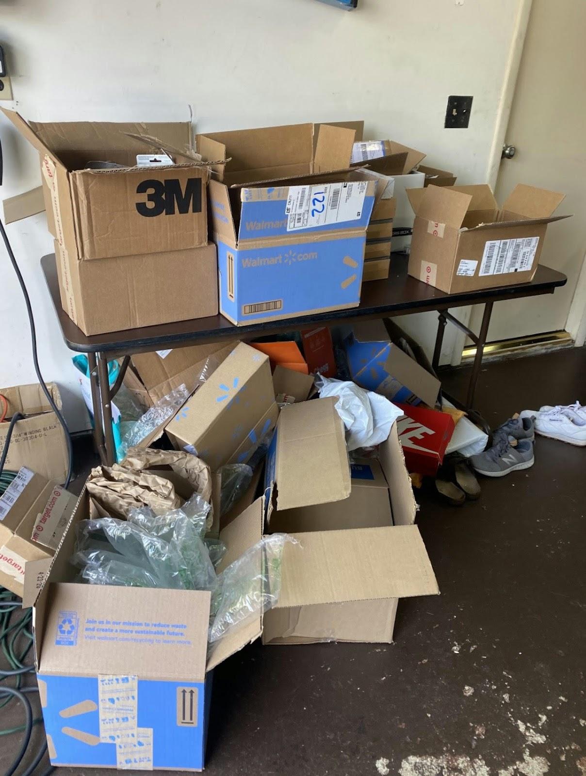 Boxes and packing supplies in the garage where Awesome Solutions started